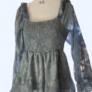 Blue floral blouse with sheer ruffled sleeves and a babydoll style M unbranded